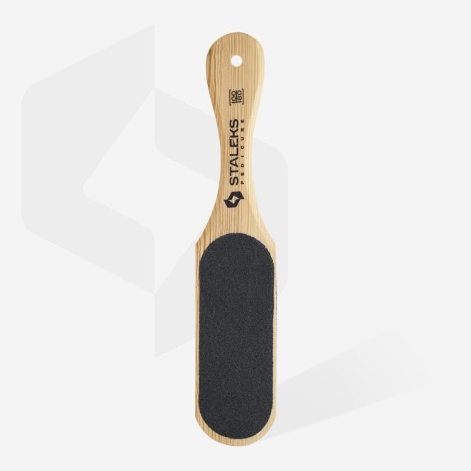 Wooden-handled pedicure foot file with a black abrasive surface for smoothing dry skin