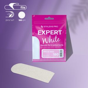 Bright pink “EXPERT White” foot-file packaging with disposable pedicure files and a beige foot file beside it on a purple surface.