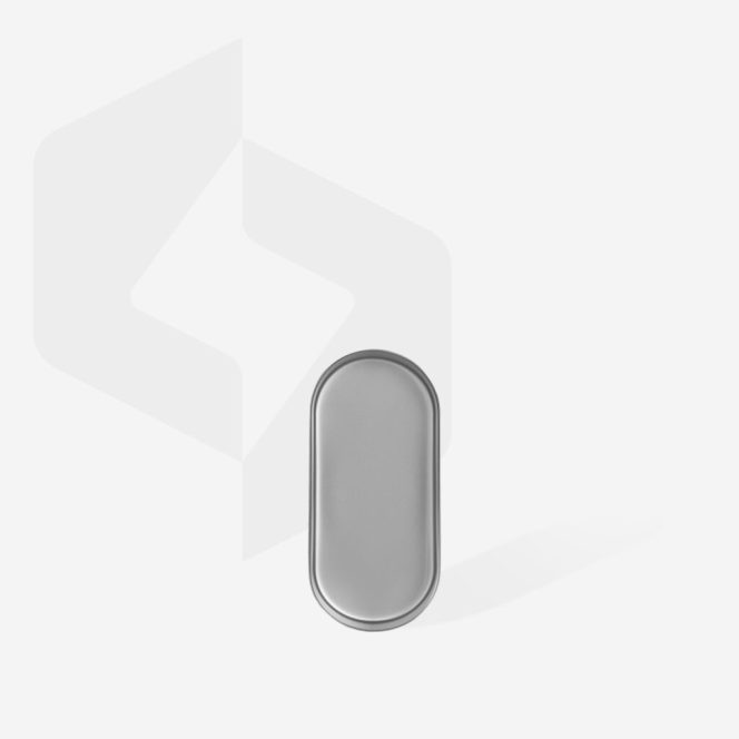 Oval silver metal pillbox on a white background with a faint geometric backdrop behind it.